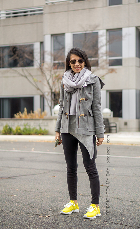 gray scarf, gray toggle duffle coat, gray asymmetric top, black skinny jeans, yellow sneakers
