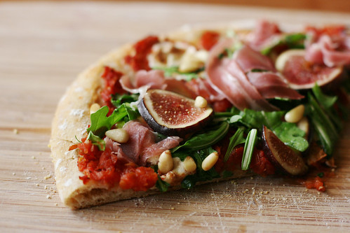 Prosciutto (fig) pizza with arugula and pine nuts