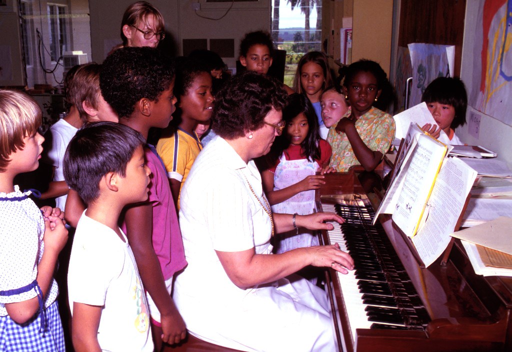 School children learning music in a music class