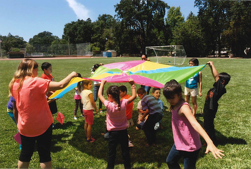 Children at Calistoga Family Apartments, a farm labor housing complex, enjoying one of the many group games during the after-school program “Kids Club”