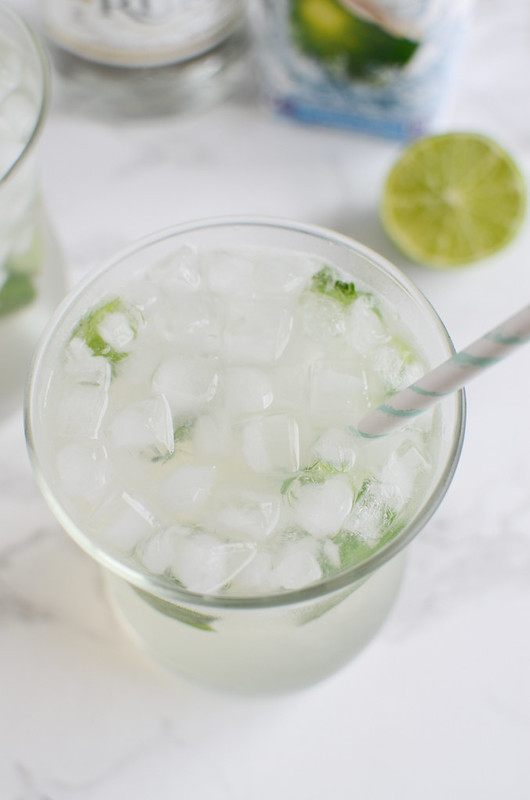 Skinny Coconut Mojito - the ultimate summer drink recipe! Coconut water, rum, limes, and mint! It's low calorie but still so delicious. 