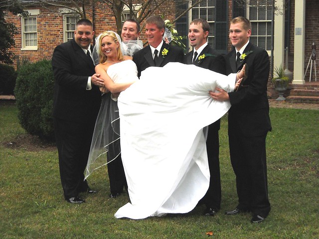 A bride and her groomsmen at the Jones-Stewart Mansion at Chippokes State Park, Virginia