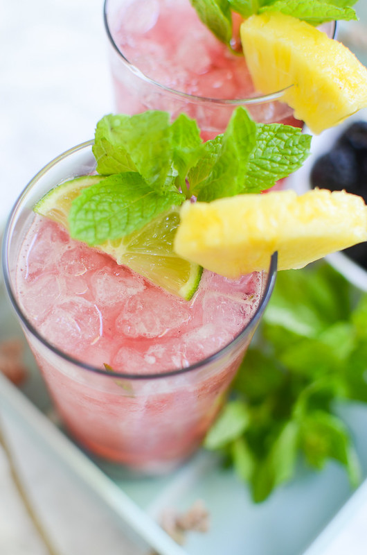 Pineapple Blackberry Mojitos - the BEST summer cocktail recipe! Pineapple, blackberries, and mint are crushed and then mixed with rum, lime juice, and sparkling water!