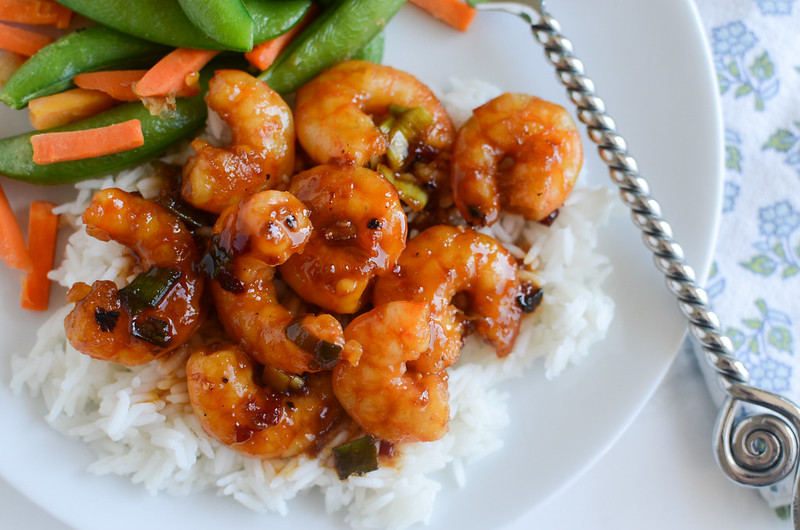 Spicy Orange Shrimp - light and healthy dinner recipe! Shrimp in a spicy Asian-inspired sauce. Ready in about 20 minutes so it's a perfect weeknight meal!