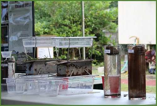 A rainfall simulator on the left and a soil clods comparison on the right