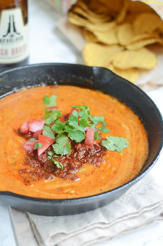 Queso Fundido - spicy cheese dip with chorizo! Serve with tortilla chips for the perfect party snack!