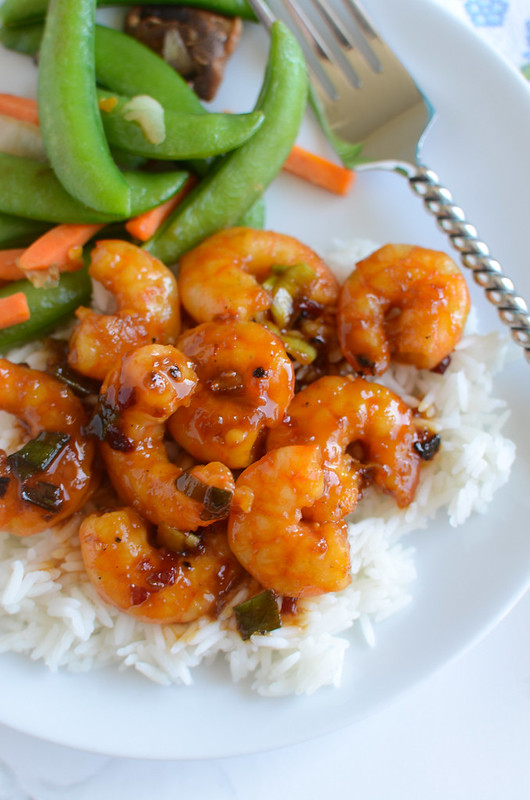 Spicy Orange Shrimp - light and healthy dinner recipe! Shrimp in a spicy Asian-inspired sauce. Ready in about 20 minutes so it's a perfect weeknight meal!