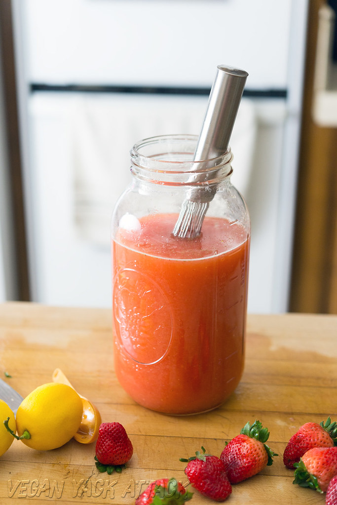 A large jar of Boozy Mint Strawberry Lemonade mix