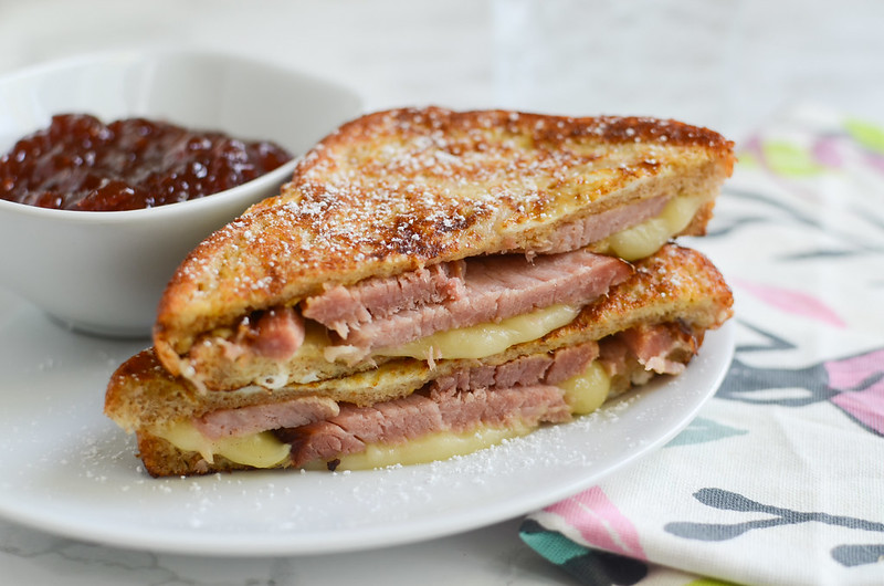 Monte Cristo Sandwiches - grilled ham and cheese sandwiches topped with powdered sugar and served with strawberry jam. The best sweet and savory brunch recipe!