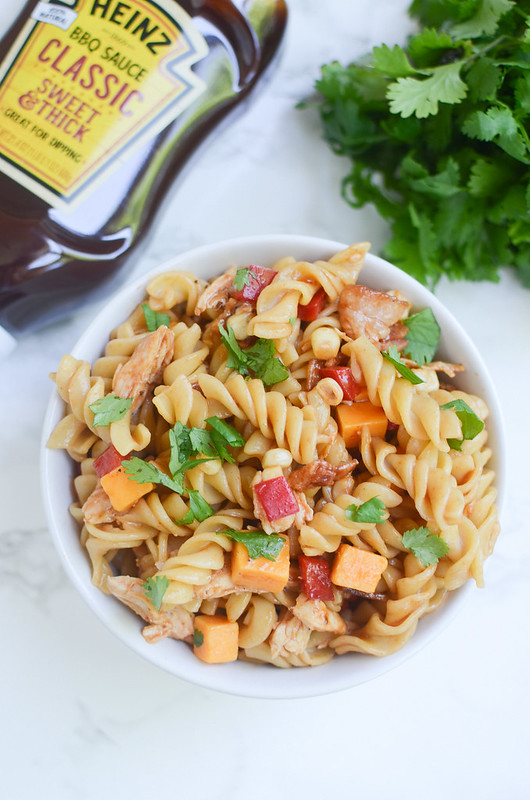 BBQ Chicken Pasta Salad - perfect for potlucks and barbecues! Pasta, chicken, cheddar cheese, bell peppers, corn, and bacon all tossed with barbecue sauce! So easy and so delicious!