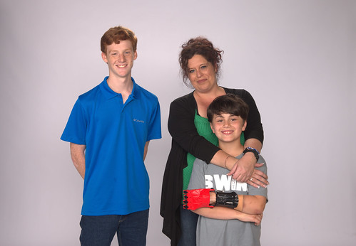 Zach McCleery posing with Melina Brown and her son Ethan