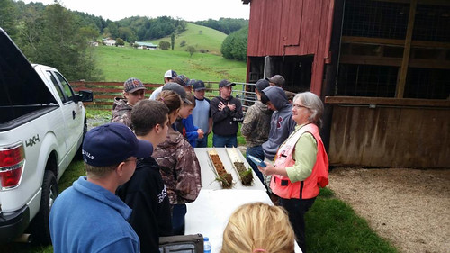 NRCS Resource Soil Scientist Jeannine Freyman using a soil profile to highlight differences in soil types and their suitability for agriculture and other uses at a workshop on the New River Hill Farm