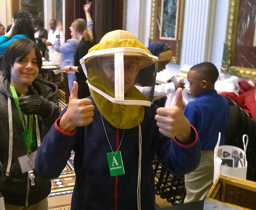 Students from Baltimore and Washington, D.C. schools trying out different scientific careers like ARS bee researcher at the White House Day at the Lab