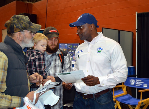 King Whetstone, (right), regional director of USDA's National Agricultural Statistics Service Northeastern Regional Field Office, meeting with attendees