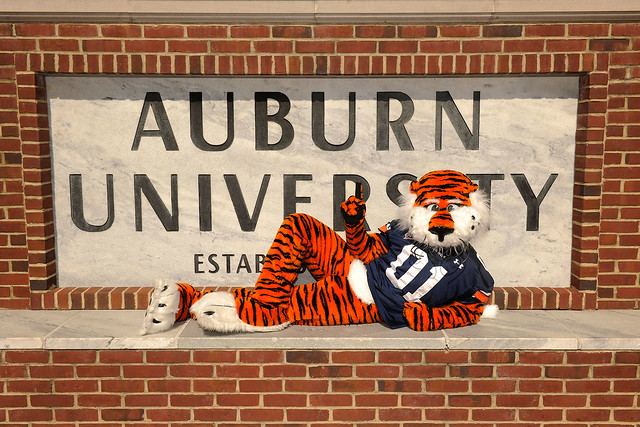 Aubie in front of the Auburn sign