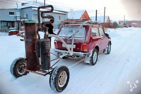 In order to save gas money Ukraine drivers with wood-powered cars