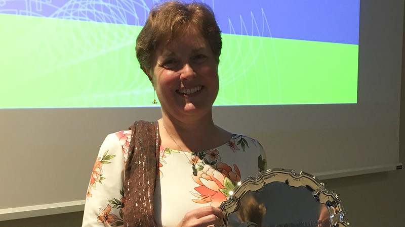 This is a photo of the 3MT® Winner Kay Fountain holding her commemorative plate.