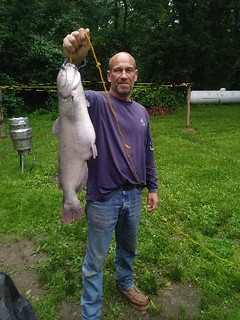Photo of man holding state record white catfish