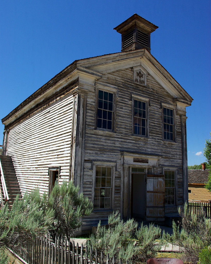 Bannack, Montana, July 30, 2010. Image shared as public domain on Pixabay and Flickr as “Schoolhouse and Masonic Lodge.”