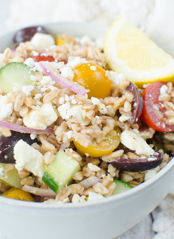 Greek Farro Salad - Farro, cucumber, tomatoes, kalamata olives, red onion and feta cheese tossed in a light lemony dressing. Perfect healthy lunch recipe!