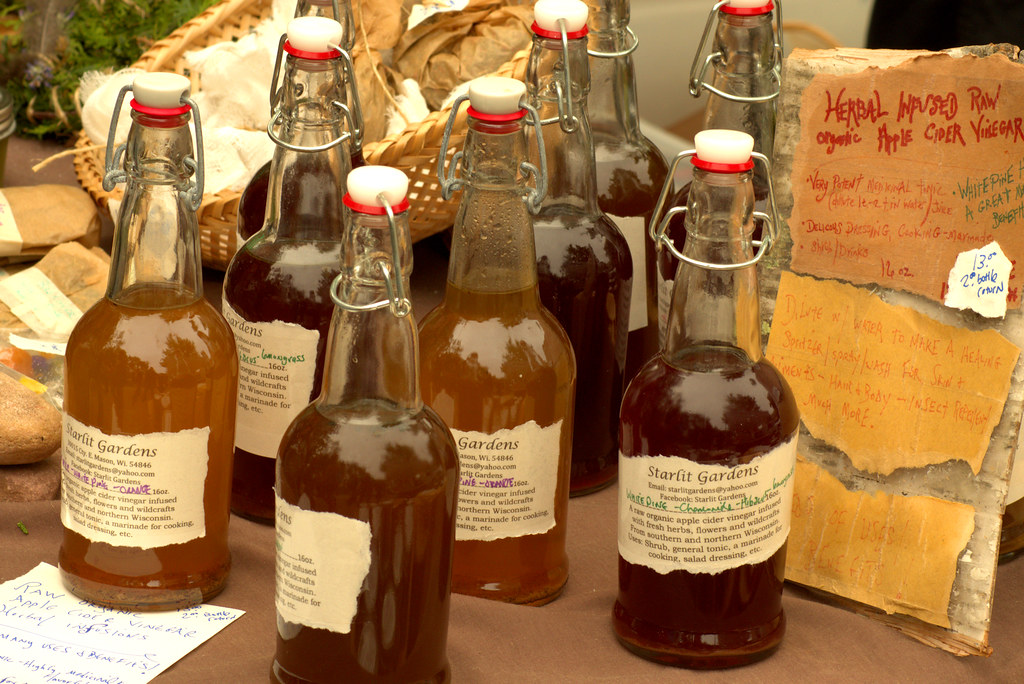 Apple Cider Vinegar - Dane County Farmers Market Saturday on the Square, Madison, Wisconsin, June 2, 2018. Photo shared as public domain at Pixabay and Flickr. 