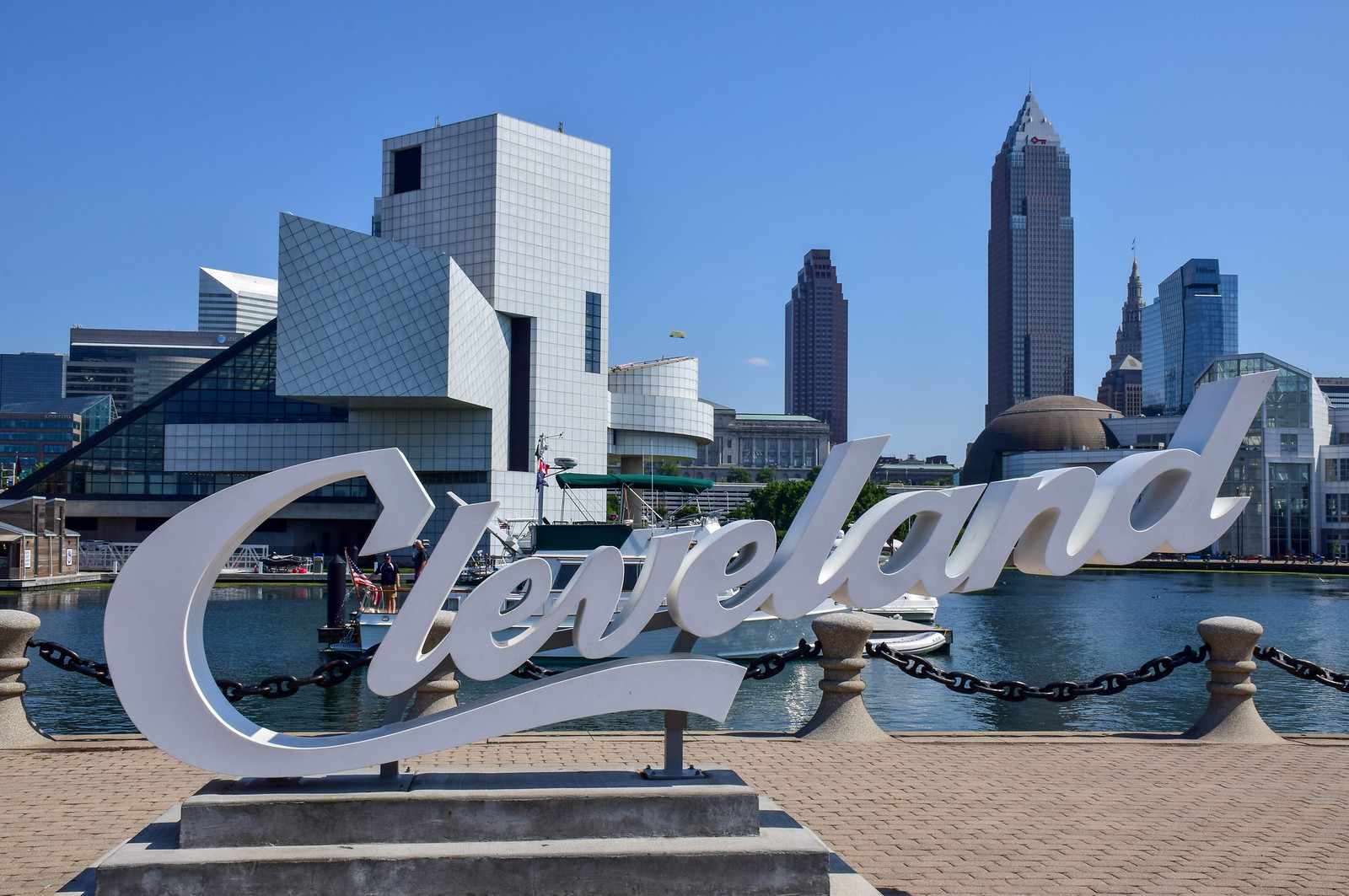 The Cleveland sign in front of the Rock and Roll Hall of Fame and city skyline