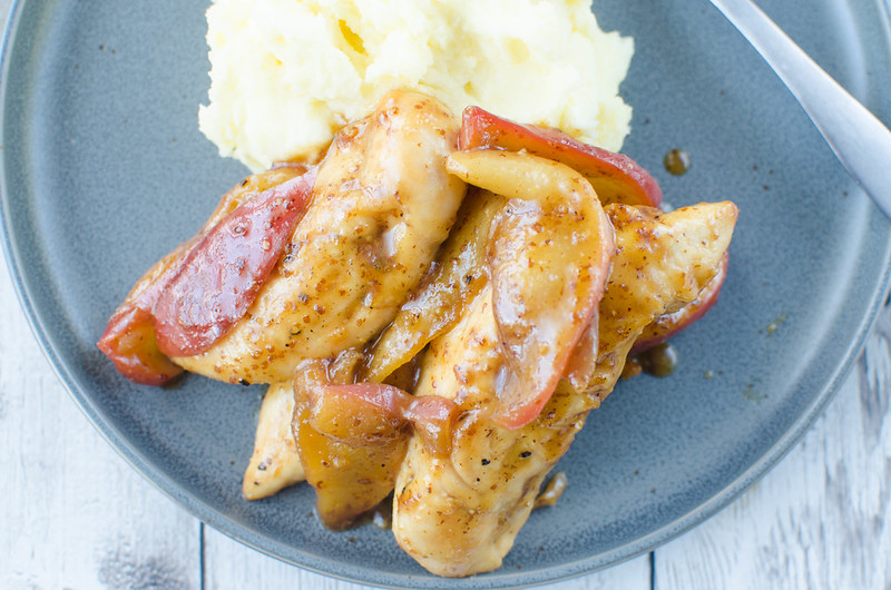Apple Mustard Chicken Tenders - family favorite fall recipe! Chicken tenders topped with sweet and spicy sauteed apples. Ready in 20 minutes and perfect over mashed potatoes or rice to soak up all the sauce!