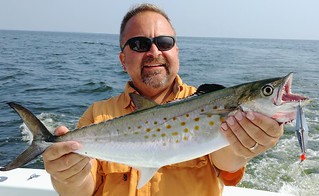 Photo of man holding up a nice Spanish mackerel