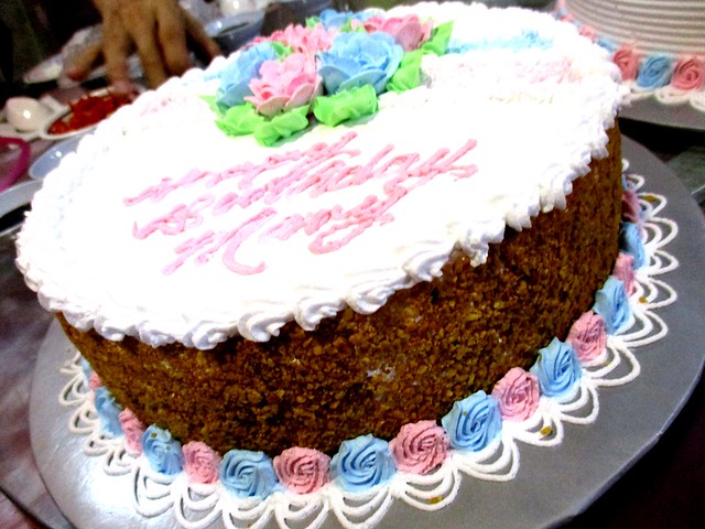 Birthday cake with crushed peanut coating