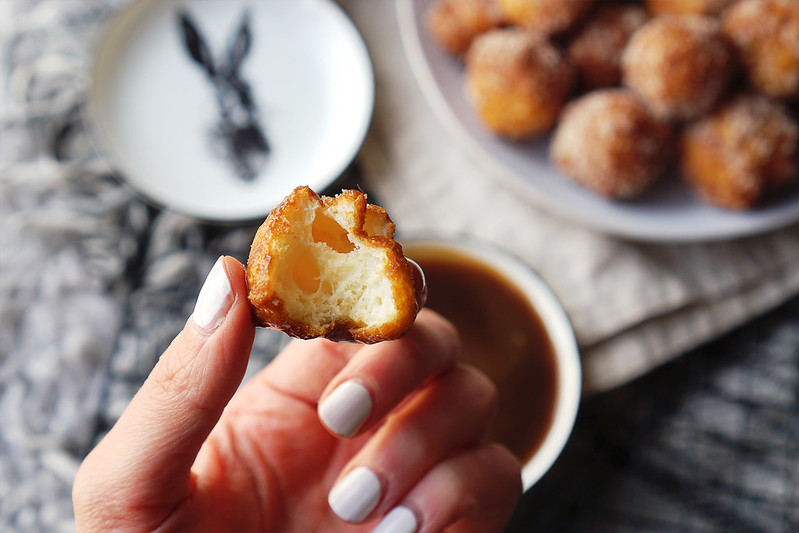 Light and airy gluten free churro donut holes rolled in cinnamon sugar with a homemade caramel dipping sauce.