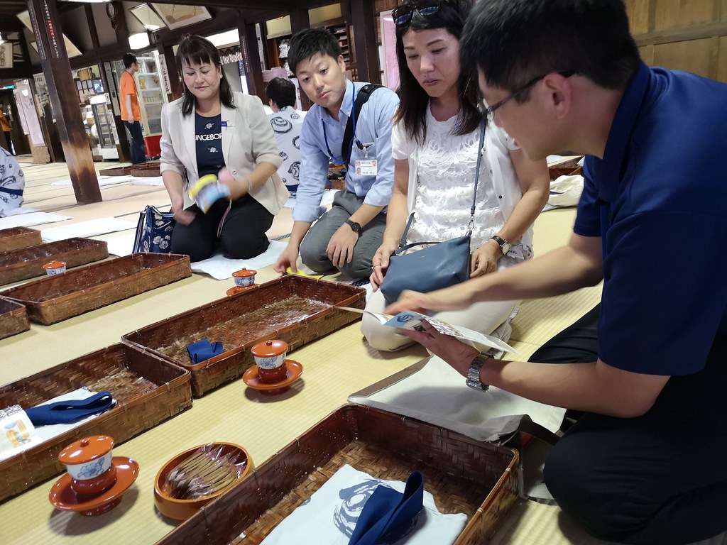 Our guides listen intently to the Dogo Onsen guide at the rest area on the second floor of the main building. The green tea is brewed with water that has been heated by charcoal. 