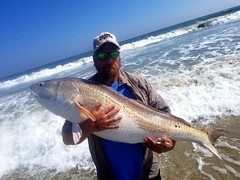 Photo of Man with a large red drum
