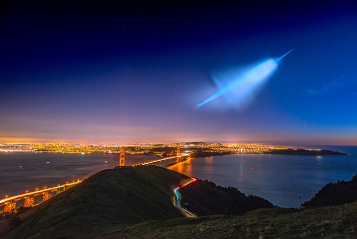 A missile trail in the sky over the Golden Gate Bridge.