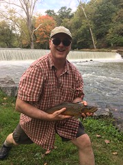 Photo of Man holding trout.