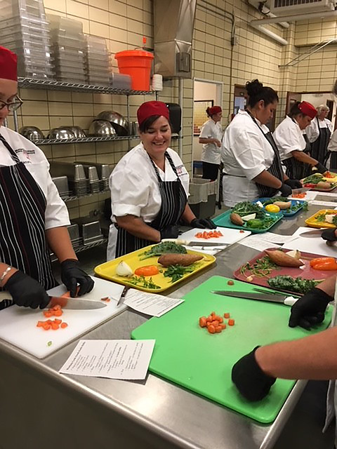 Participants learning scratch cooking and knife skills at Montana school nutrition training