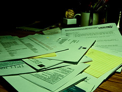Several forms scattered on the table.