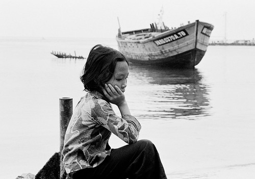 A young Vietnamese refugee resting at the Pulan Bidong refugee camp in Malaysia.