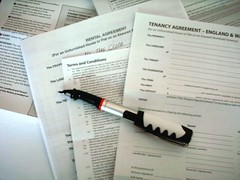 Signing a tenancy agreement.