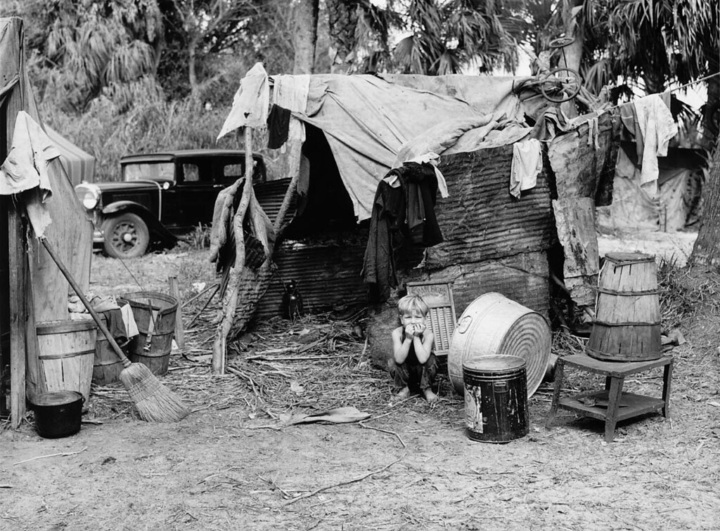 marion-post-wolcott-child-in-doorway-of-shack-of-migrant-flickr