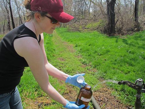 Penn State University doctoral candidate Alison Franklin collecting samples of treated wastewater