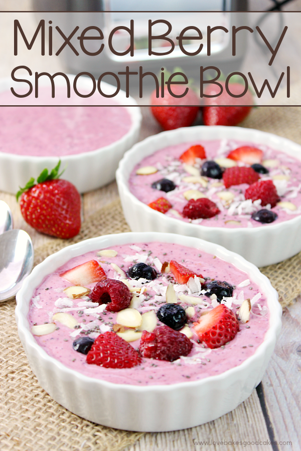 Mixed Berry Smoothie Bowls with fresh berries and spoons.