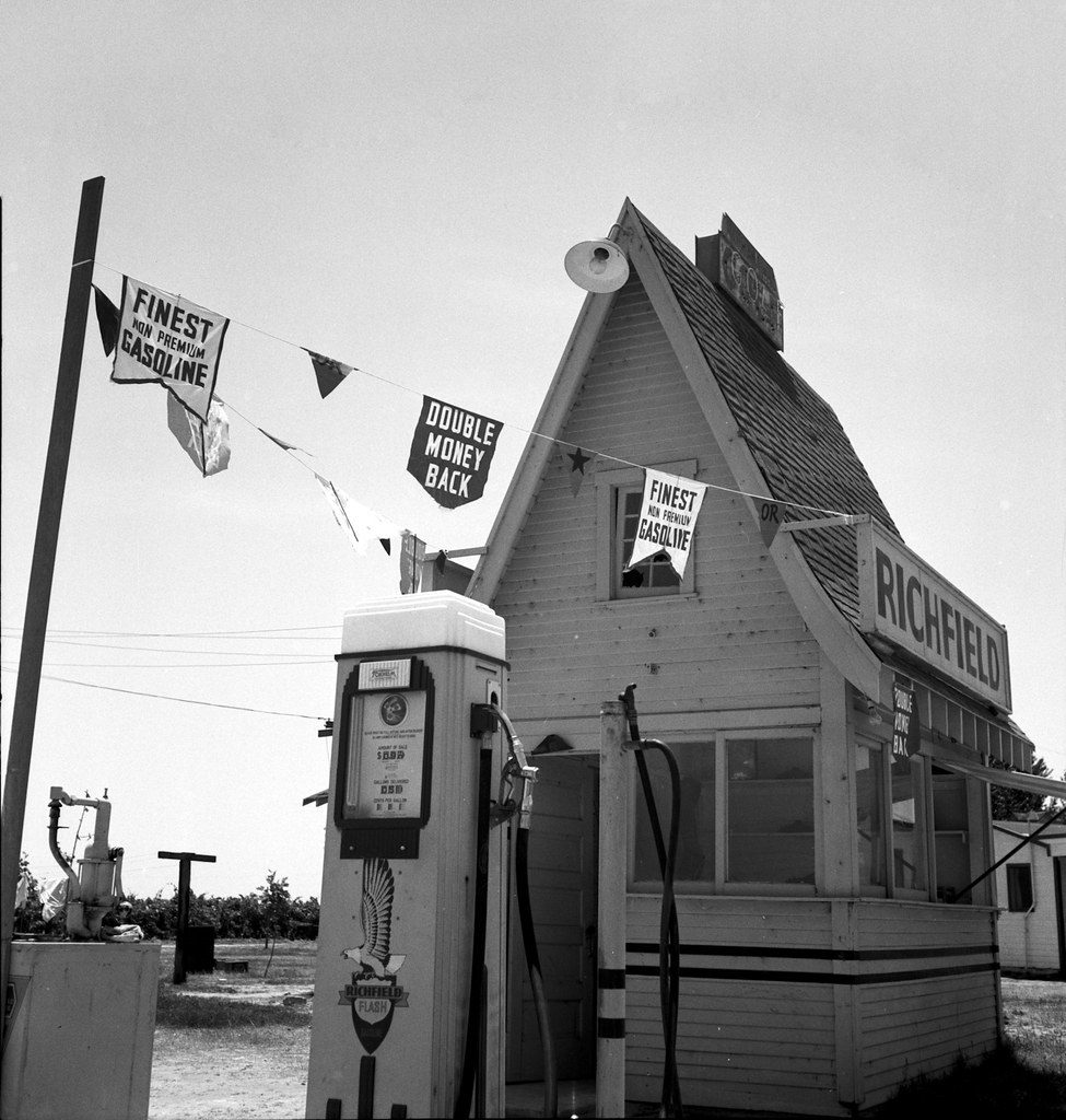 1939 California Service Station -- Between Tulare and Fresno on U.S. 99. A large variety and great number of service stations face highway.