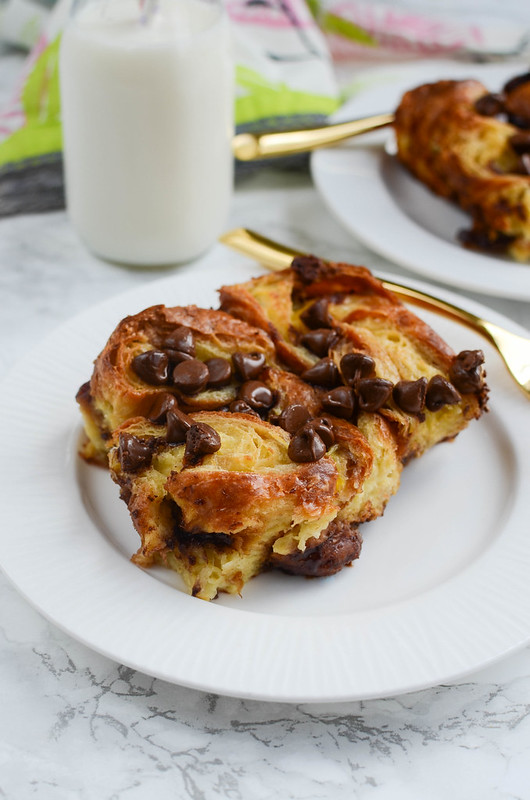 Chocolate Chip Croissant Bread Pudding - the most decadent breakfast (or dessert)! Sliced croissants in sweet custard with chocolate chips sprinkled in!