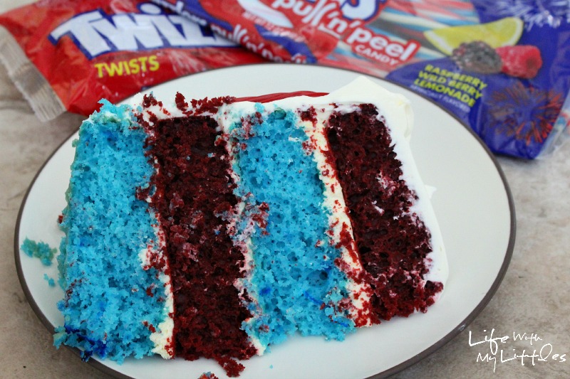 Celebrate the Fourth of July with this easy and delicious patriotic layer cake! It's way easier than it looks, and uses Twizzlers for the decorations!