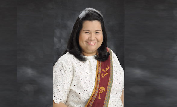 The image shows Ms. Grace Gomez wearing UP graduation uniform with red strap.