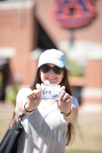 A student named Erin holds out her Hey Day name tag.