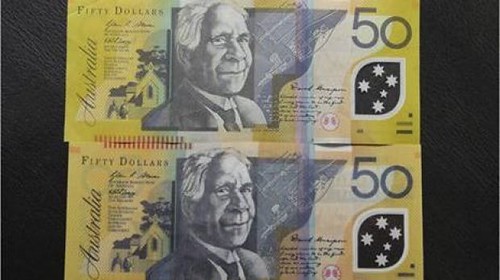 Real and Fake $50 Australian banknotes