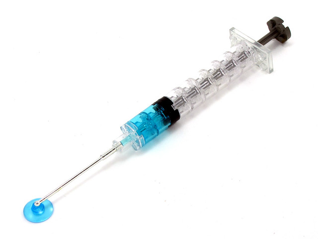 syringe with blue liquid