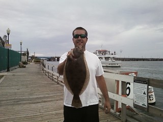 Photo of man holding a flounder