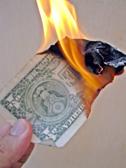 A dollar on fire.